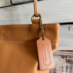 Coach beige purse. 8.5 inches wide/7 high/3.5 deep.  23 inch shoulder strap.